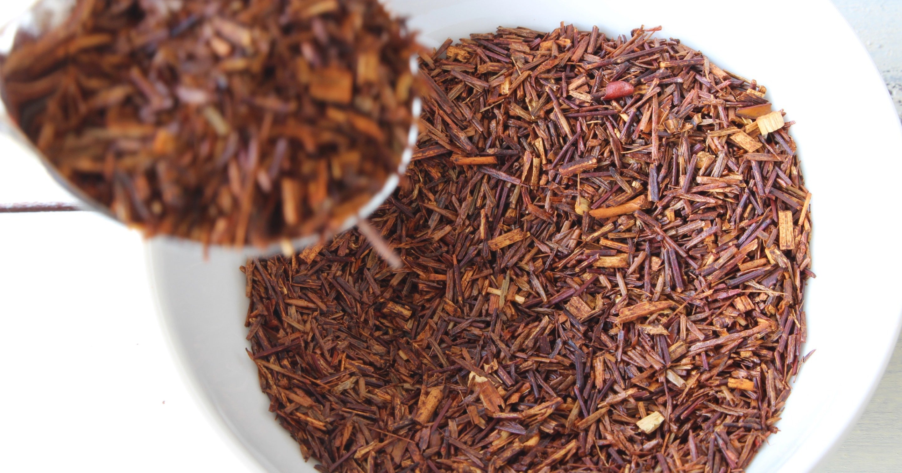 Loose leaf rooibos tea in a white bowl