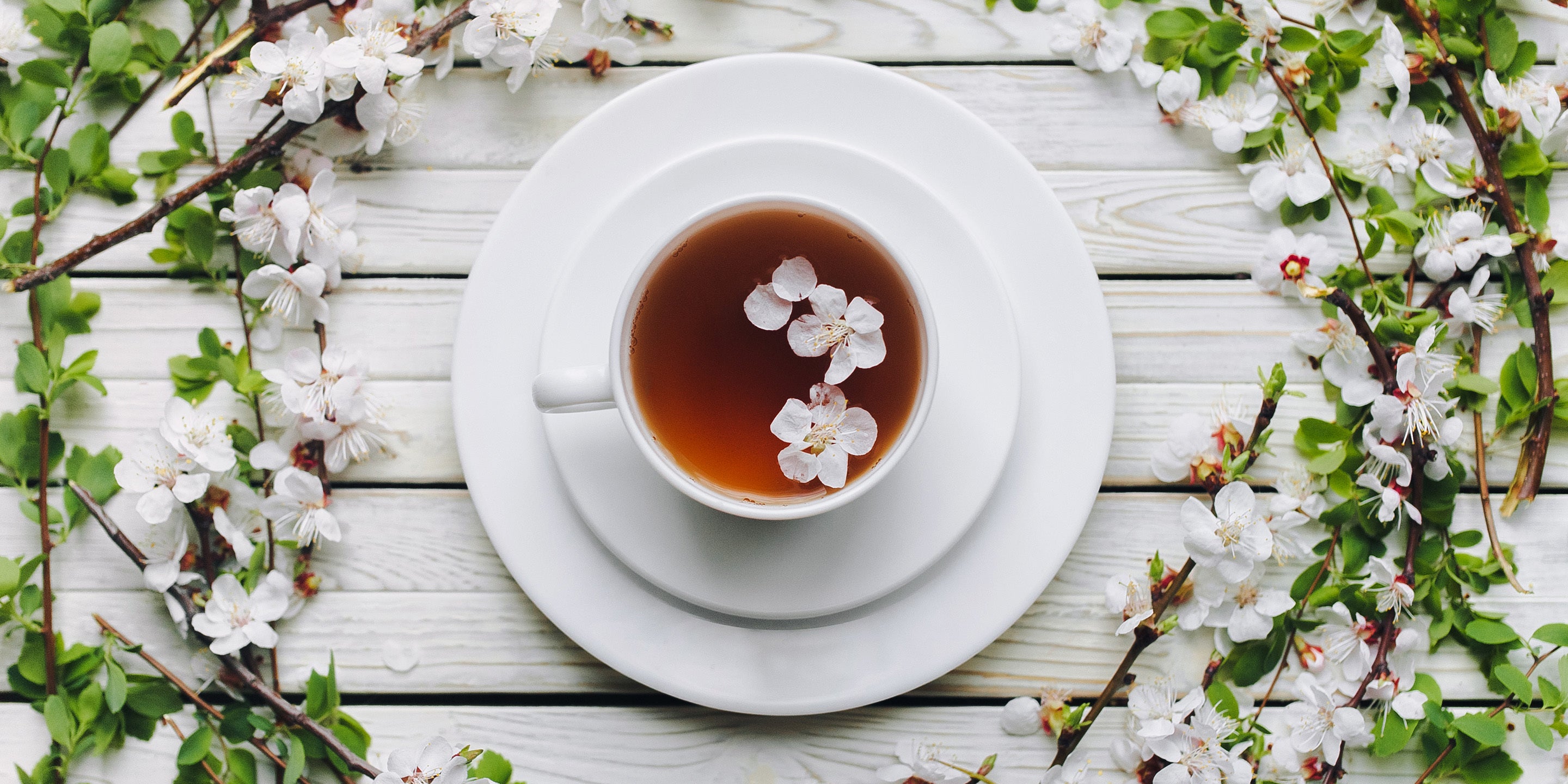 Cup of tea with flower blossoms for a wedding