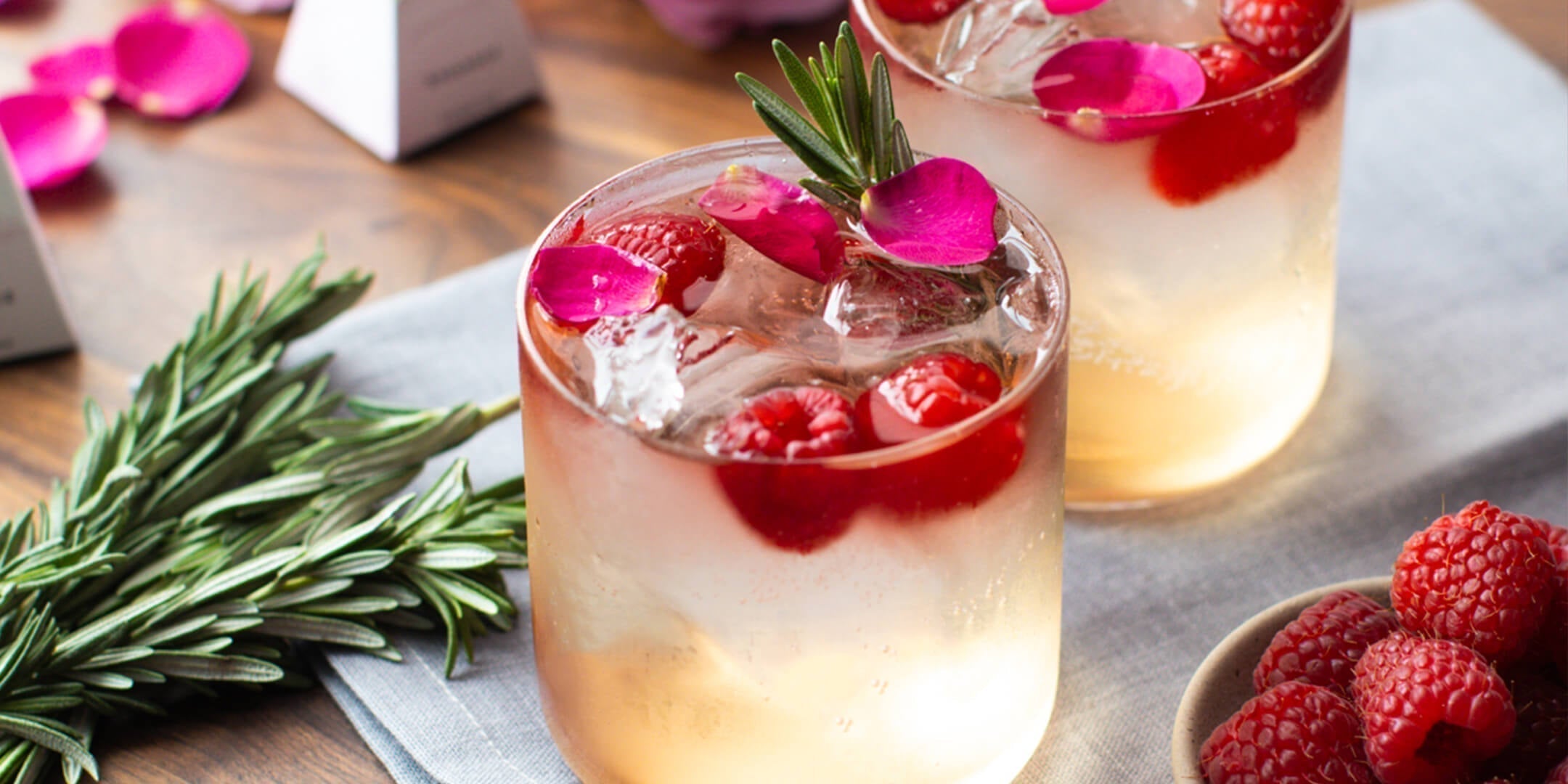 Sparkling Love Affair cocktail with rosemary, raspberries and rose petals. Photo by Emily Laurea.