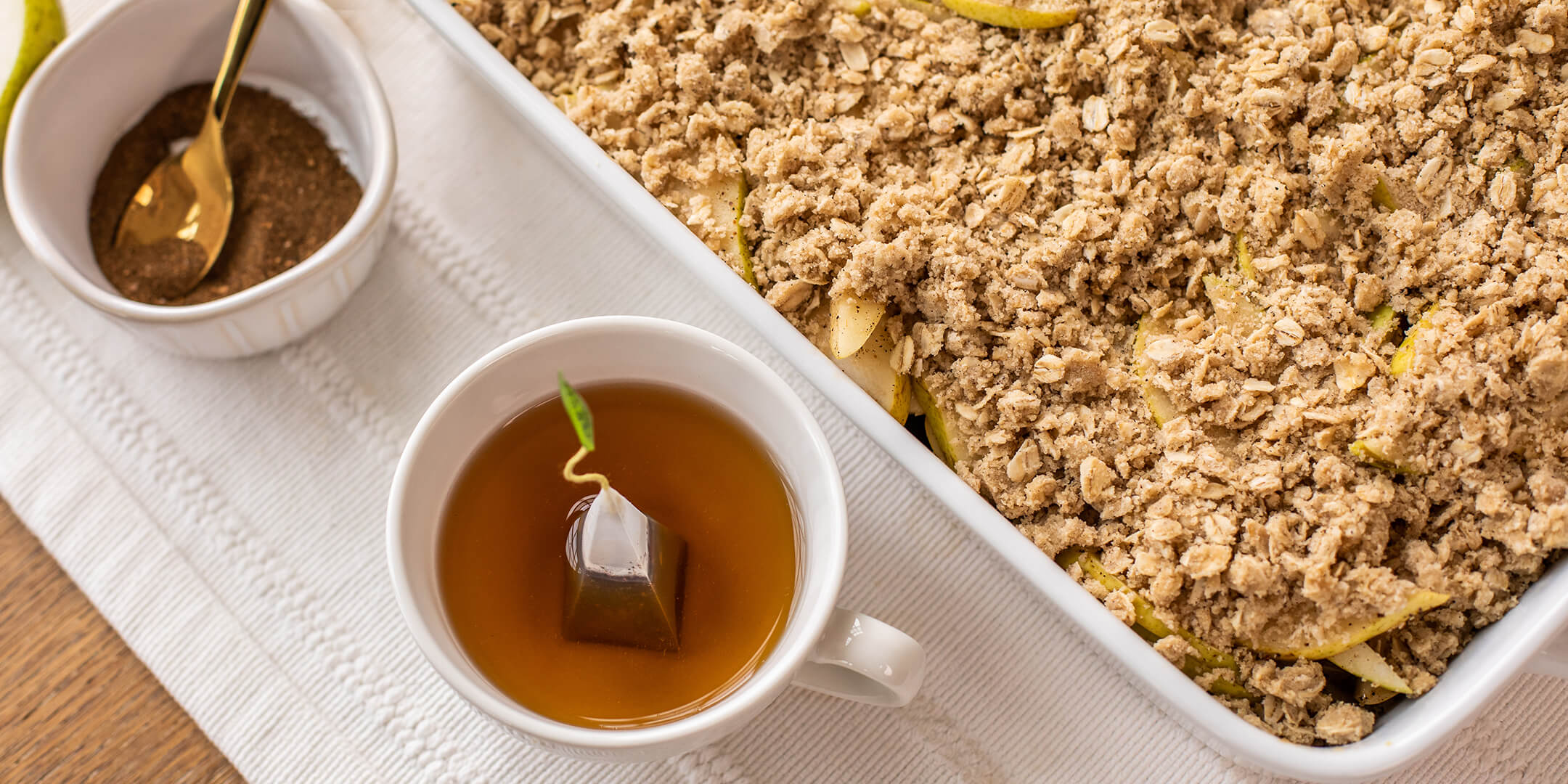 Bombay Chai Pear Crisp in a pan with tea from above