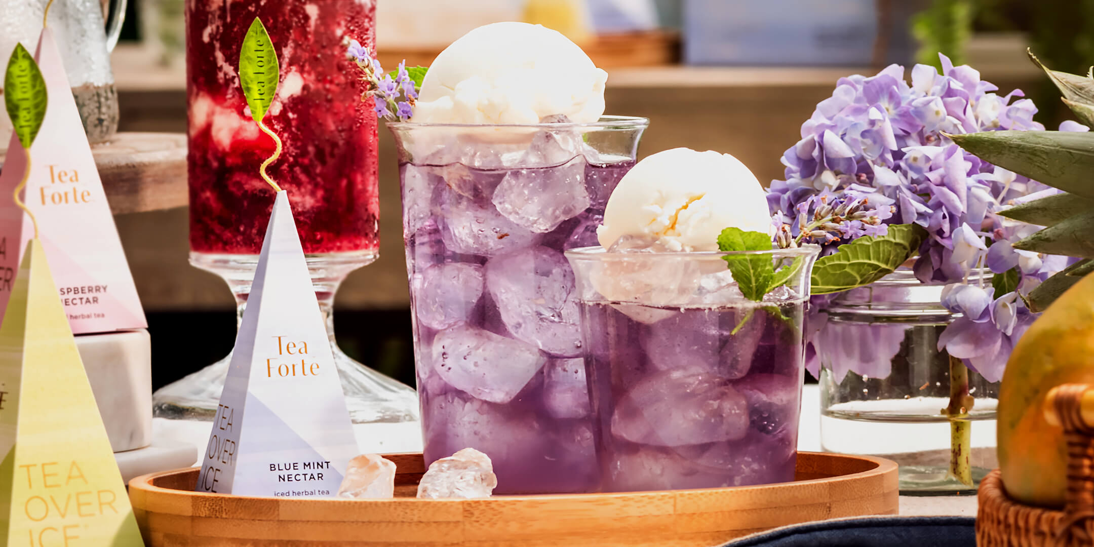 Iced Blue Mint Nectar Floats on a tray with iced tea pyramid infusers