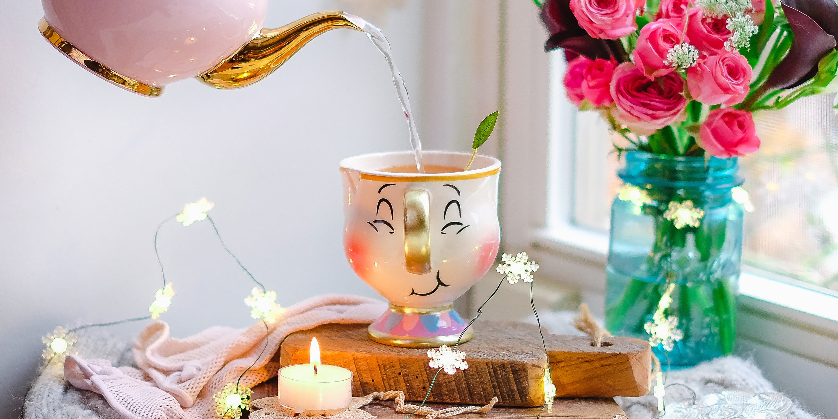 Pouring tea into a cup with a smiling face