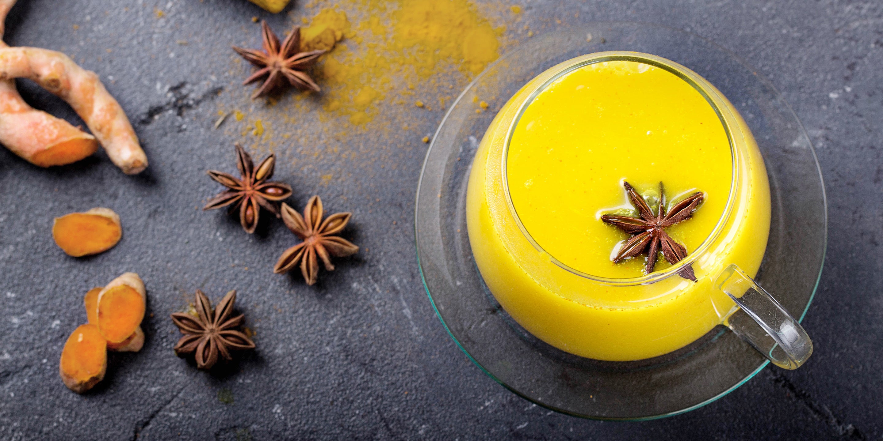 Turmeric Tea with spices in a glass cup