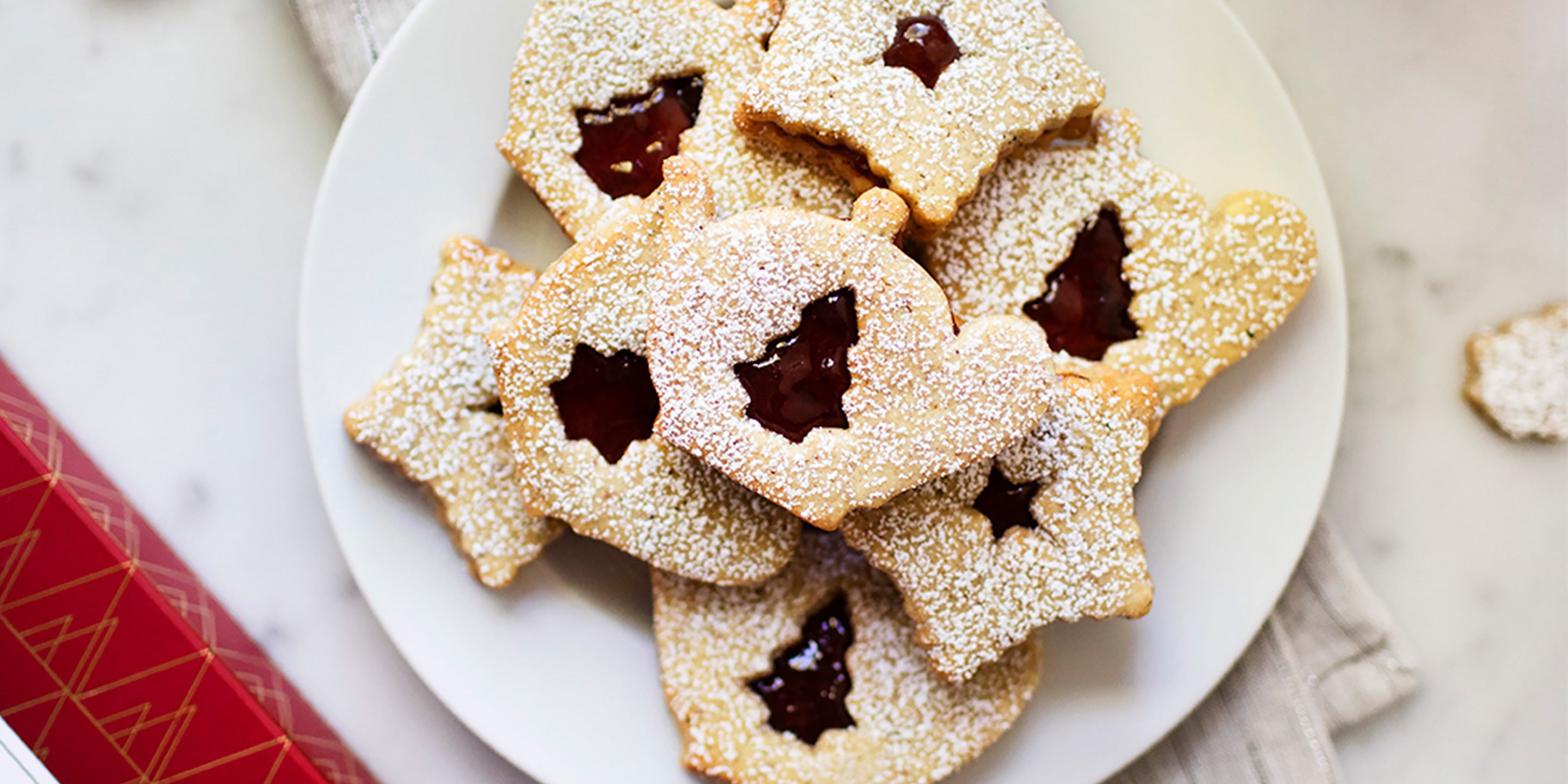 Linzer Tea Cookies on a white plate