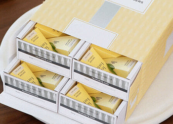 Event Box, open, revealing trays of pyramid  infusers
