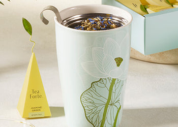 KATI Steeping Cup Lotus on a table with an infuser, lid off