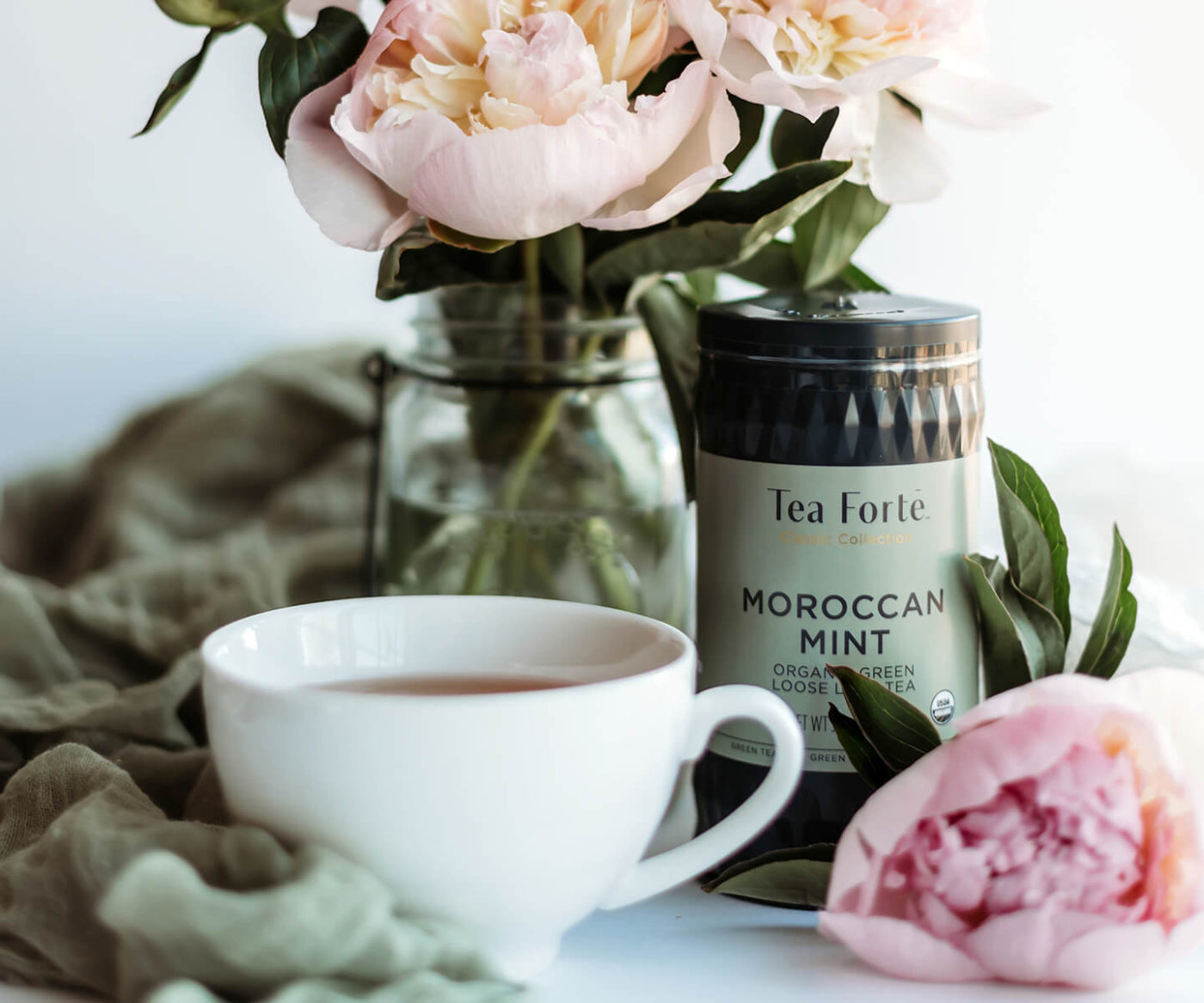 Moroccan Mint loose tea infuser with roses and teacup