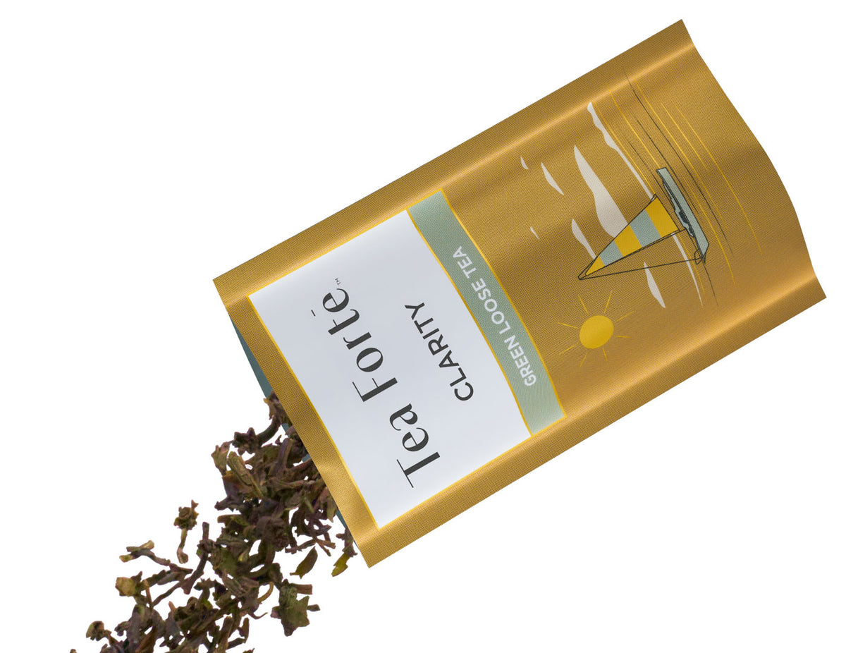 Tea Forte Clarity single steeps pouch with loose tea spilling out on a white background