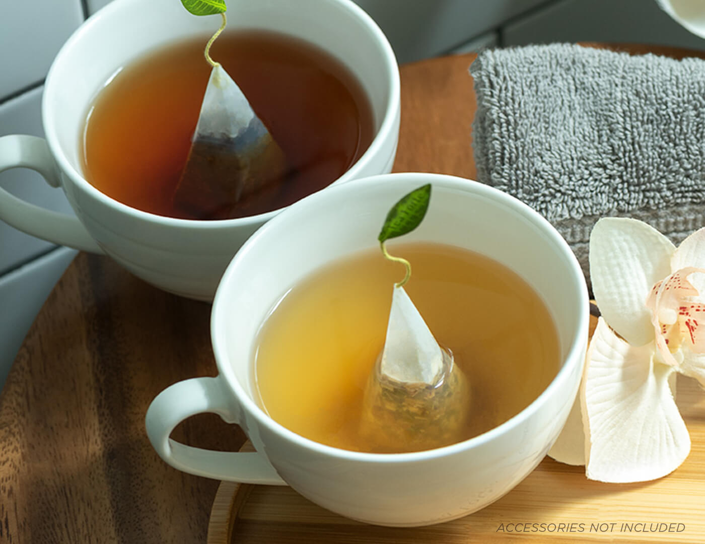 Two Café Cups with pyramid tea infusers steeping in each