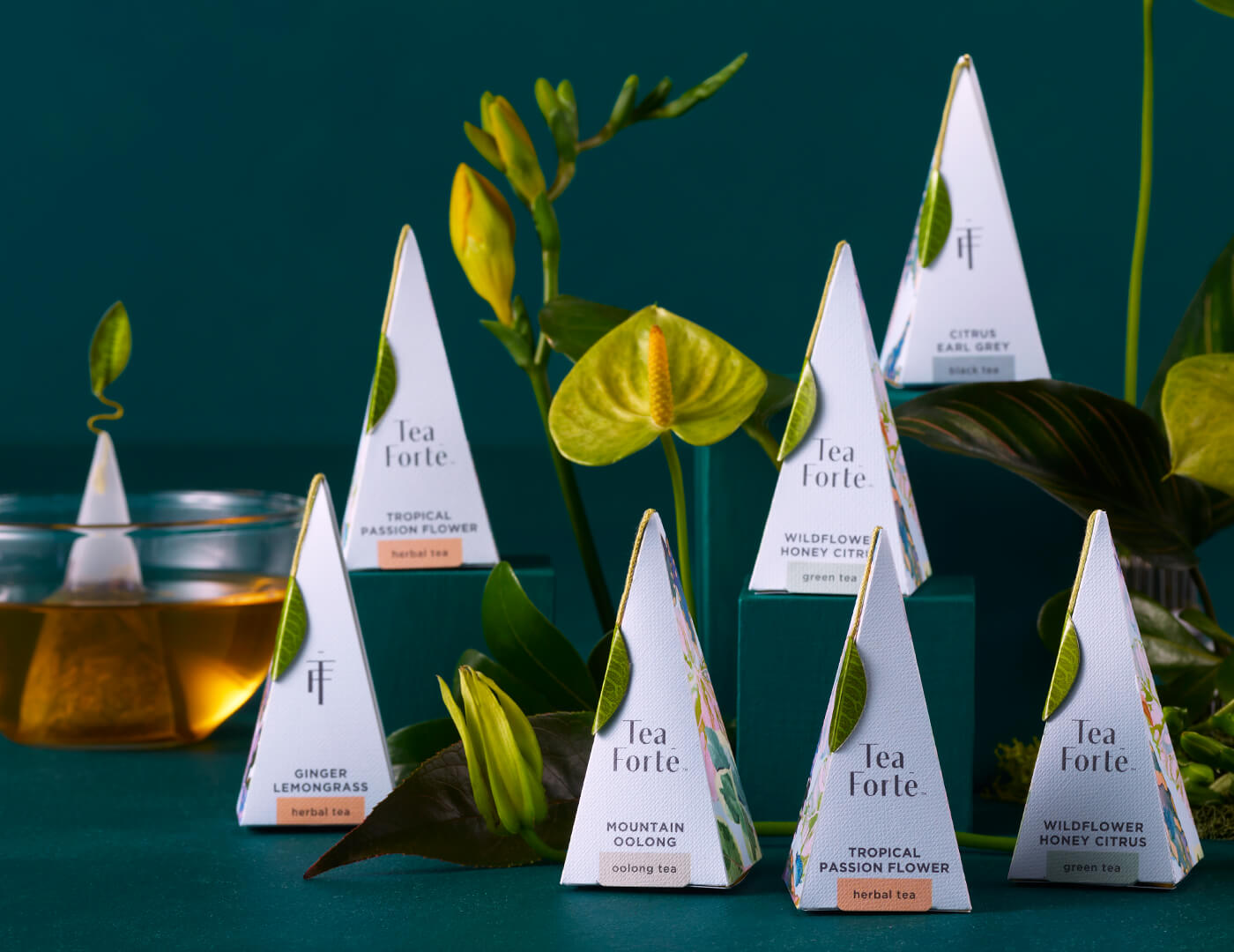 Closeup of Demoiselle pyramid infusers, amongst plants