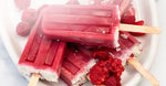 Raspberry Nectar Popsicles piled on top of one another.