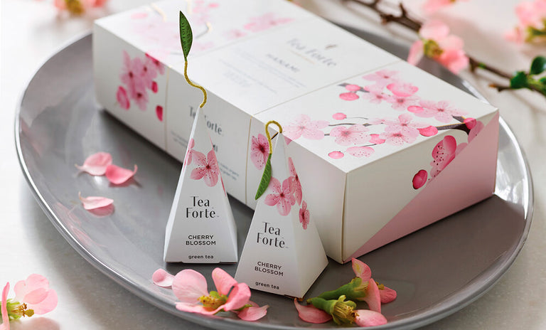Hanami Petite Presentation Box and infusers on a tray with cherry blossom petals