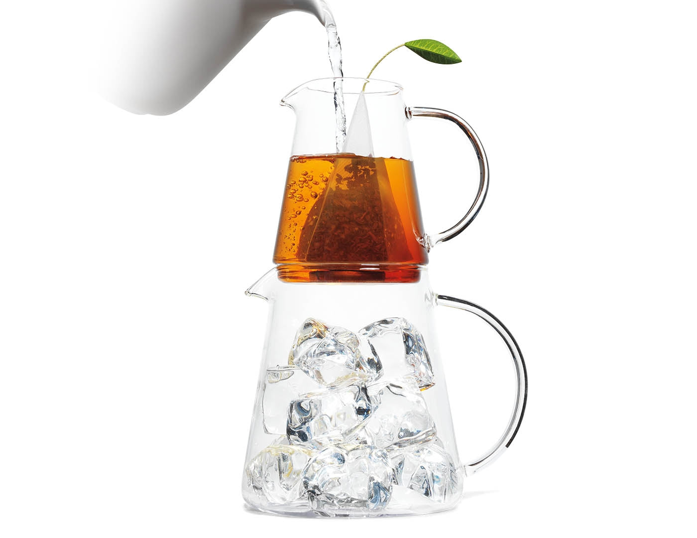 Poring hot water into a Tea Over Ice Pitcher Set